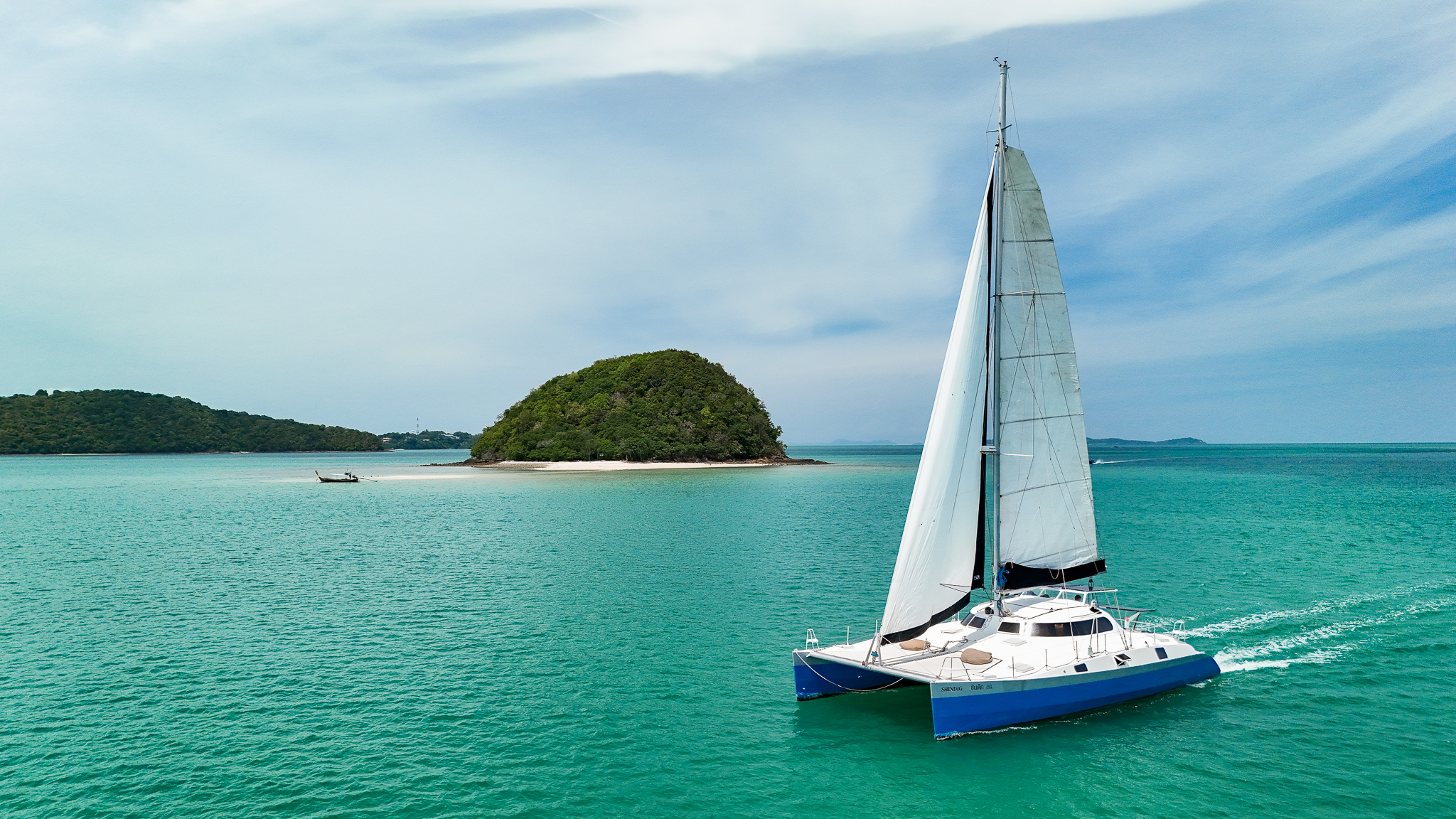 Aerial drone view of SY Shindig sailing catamaran