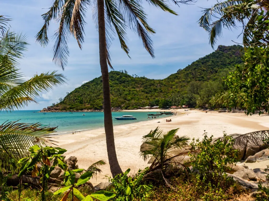 Aerial view of Koh Phangan coastline with turquoise waters