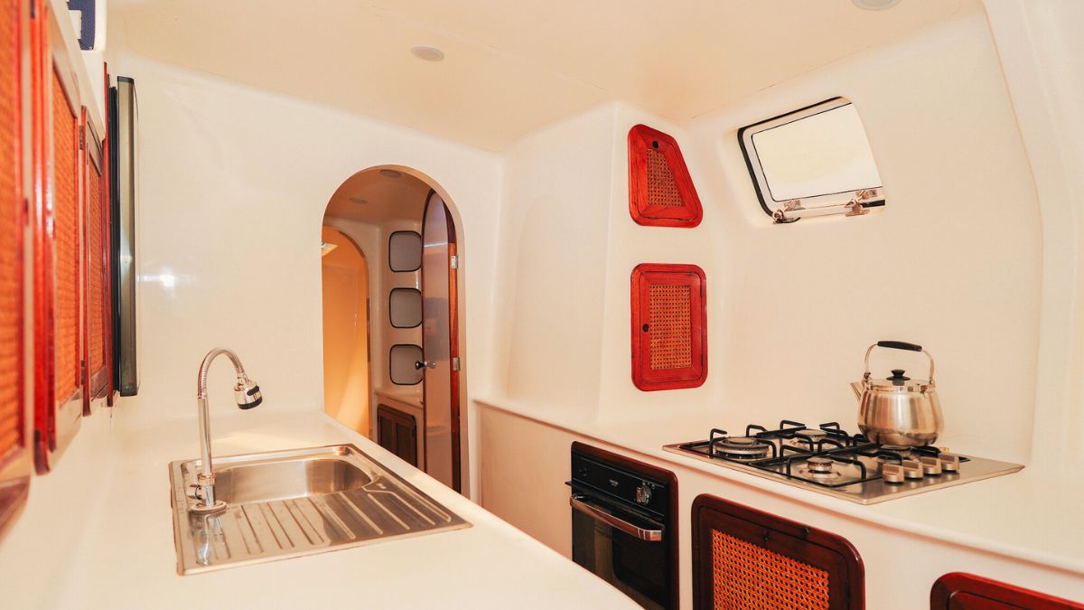SY Shindig galley kitchen with gas stove, oven and full cooking facilities